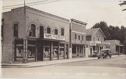 10413-S. & S. Drug Store, Corner of Mill St & Hill St. The corner of Hill St & Mill St. has been the home of a drug store for many years before Clayton Sterns & Donald Shelp bought the building and started up a chain of Drug Stores called S&S Drug Stores. Fred Kradwell ran the store for about a year before he bought the store himself.  - Postmarked 1939